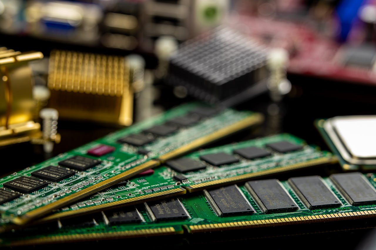 Detailed view of RAM sticks and microprocessors on a motherboard.